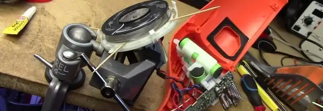 Vacuum cleaner repair parts and tools on a workbench in Ogden, UT